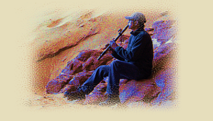 A flute player on the red rocks
